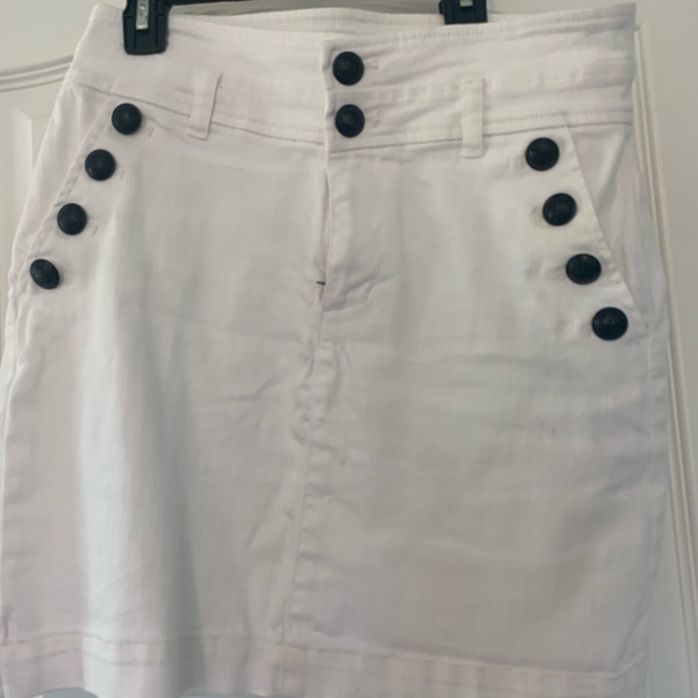 White skirt with black buttons